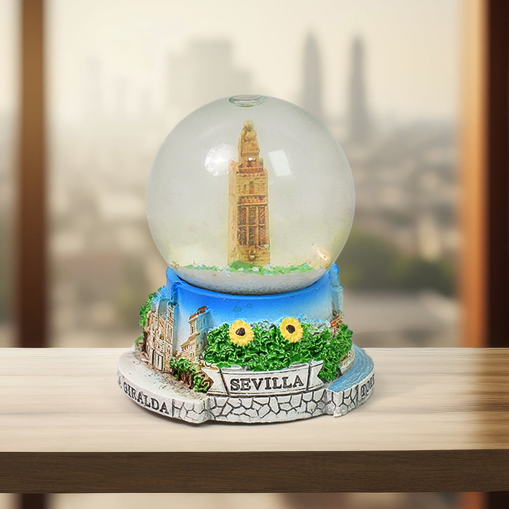 Front view of the decorative snow globe, showcasing its clear dome and base.
