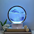 Elegant Moving Sand Art Picture with 5-color light feature in a round glass frame.