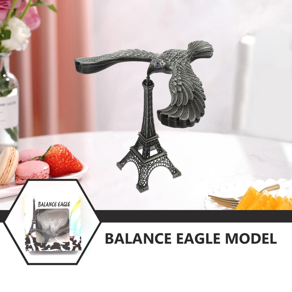 The gravity-defying metal bird statue with its Eiffel Tower base, presented as an elegant home decor item.
