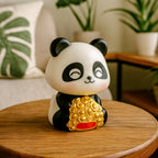 Solar panda car decor with moving head on a white background, ready for a dashboard.
