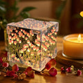 Tulip Flower LED Cube Night Lamp with warm ambient glow on table