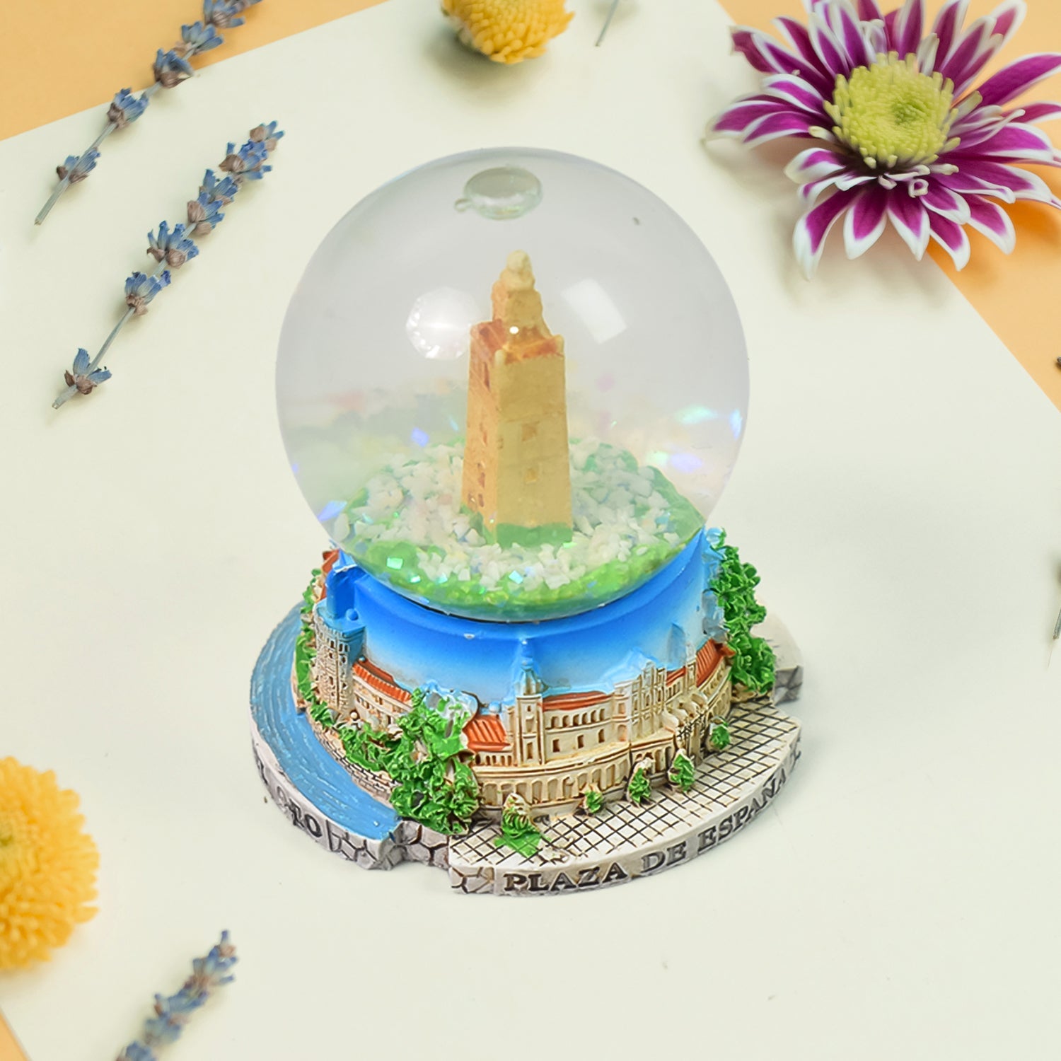 A beautifully crafted decorative snow globe featuring a festive scene, perfect for desk decor.