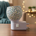 Star pattern mosaic glass night lamp glowing with warm ambient light