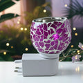 Purple mosaic glass aroma diffuser lamp glowing softly in a cozy room