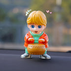 Solar Car Air Freshener with drummer design on car dashboard.
