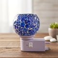 Mosaic glass night lamp emitting warm decorative glow