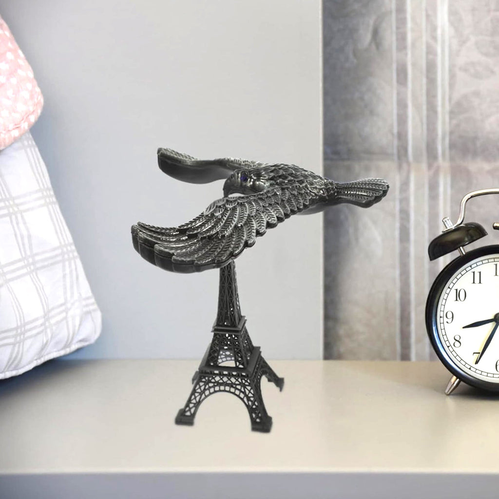 Indo Glow Balancing Eagle Toy with Eiffel Tower base on a white background, showcasing its unique design.