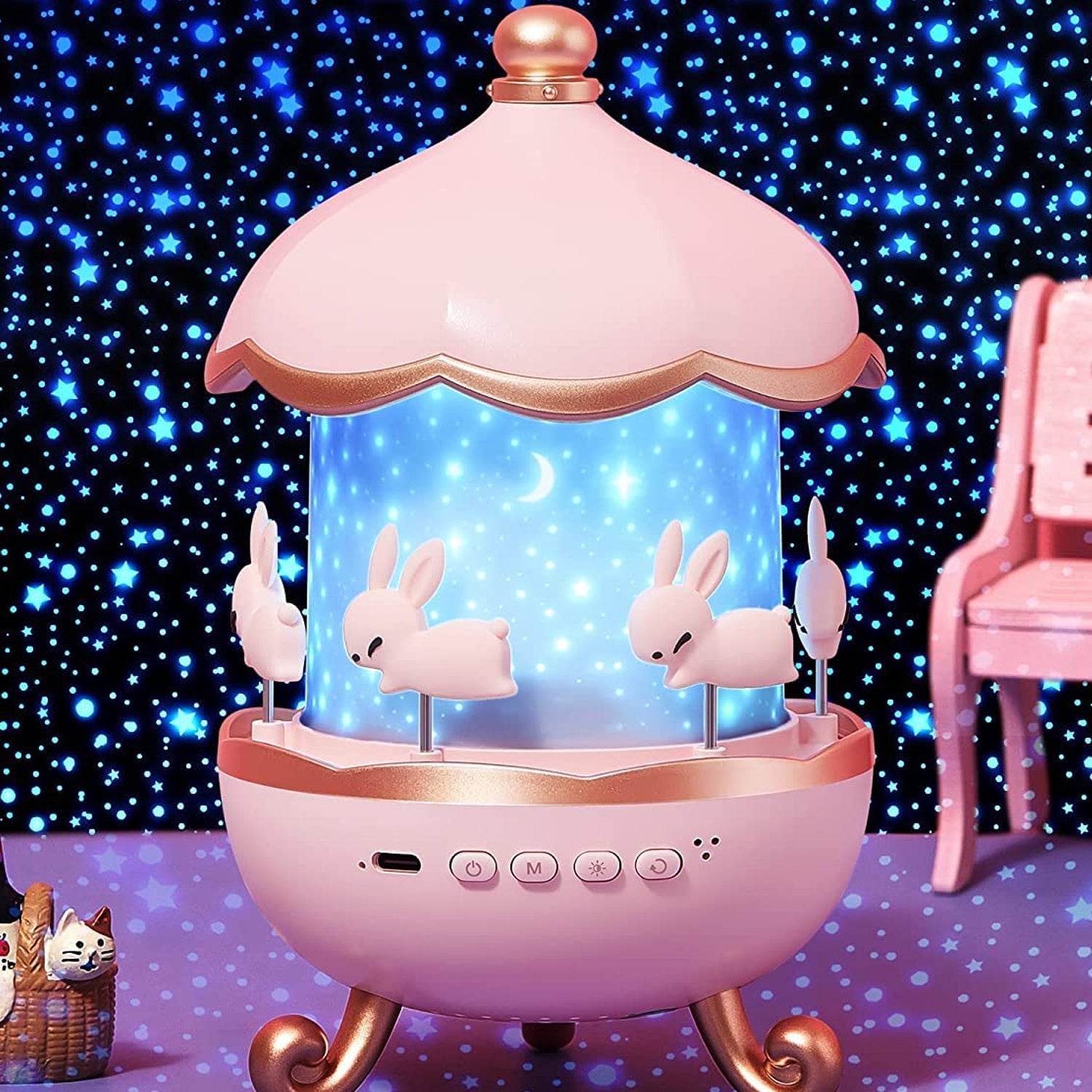 Bunny Carousel Rotating LED Night Light projecting stars and moons on ceiling
