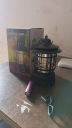Elegant retro style rechargeable LED camping lantern displayed on a wooden table.