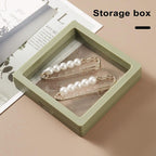 Close-up of a Floating Jewelry Display Box providing anti-oxidation protection.