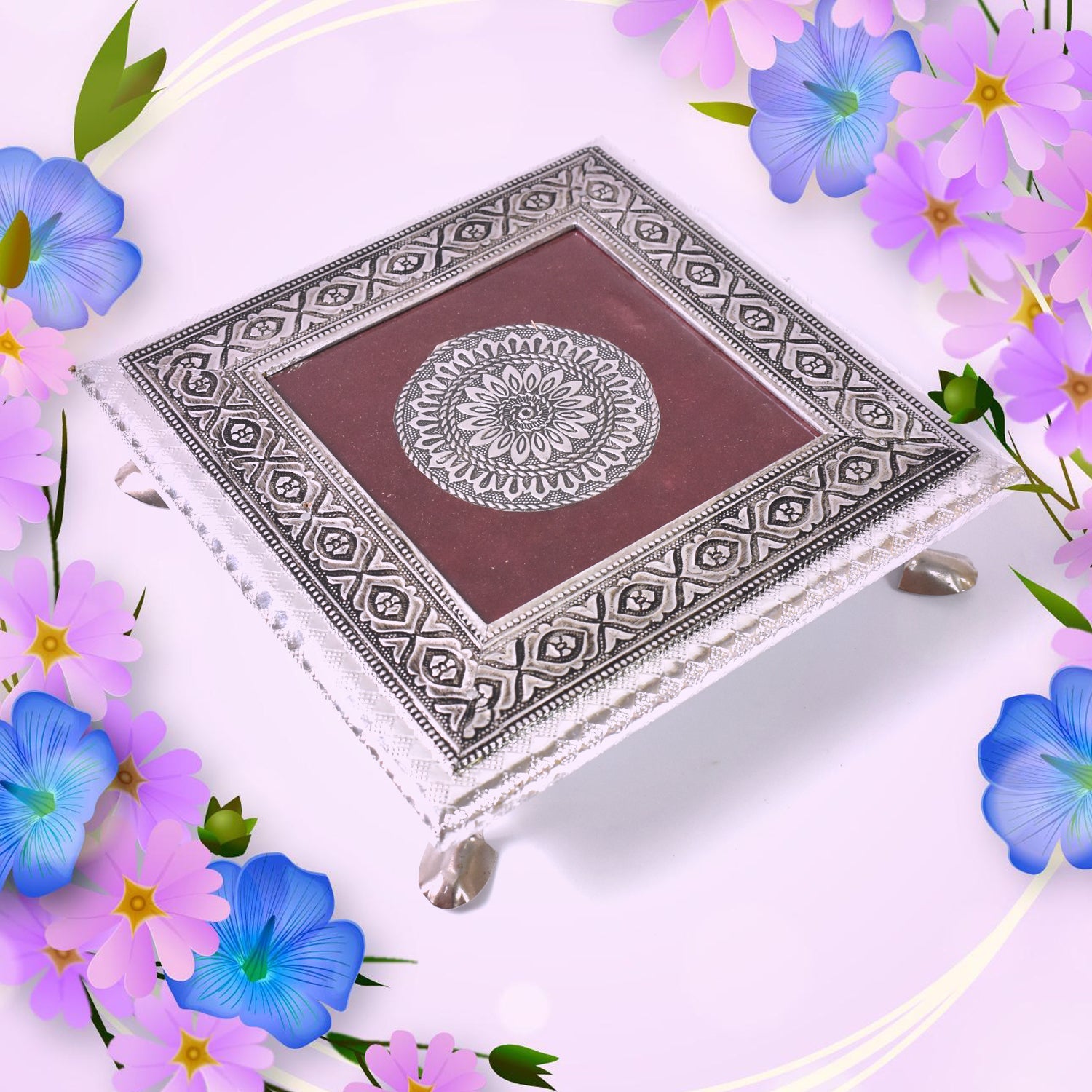 Decorative silver patla with a beautiful lotus blossom motif for traditional Indian pooja.