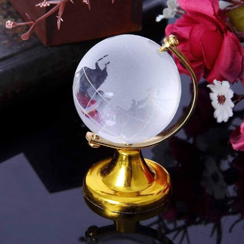 Crystal World Globe with golden stand, presented in a minimalist setting to emphasize its design.