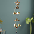 Dragonfly wind chime hanging outdoors with vibrant colors and soothing tones
