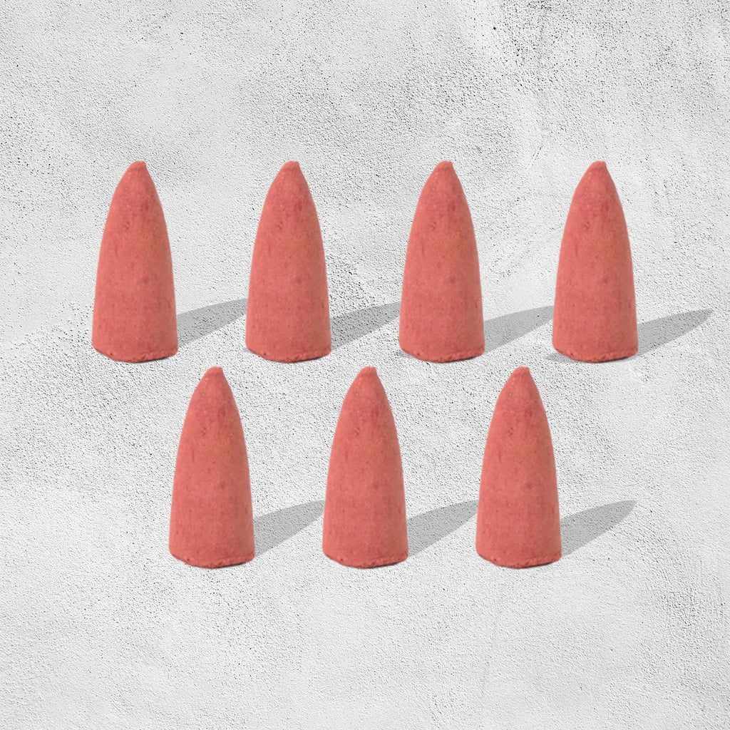 A pack of specialized backflow incense cones, essential for creating the smoke waterfall effect.