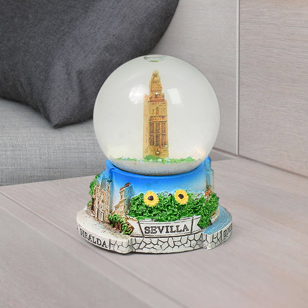 Side view of the decorative snow globe, emphasizing its compact and elegant form.