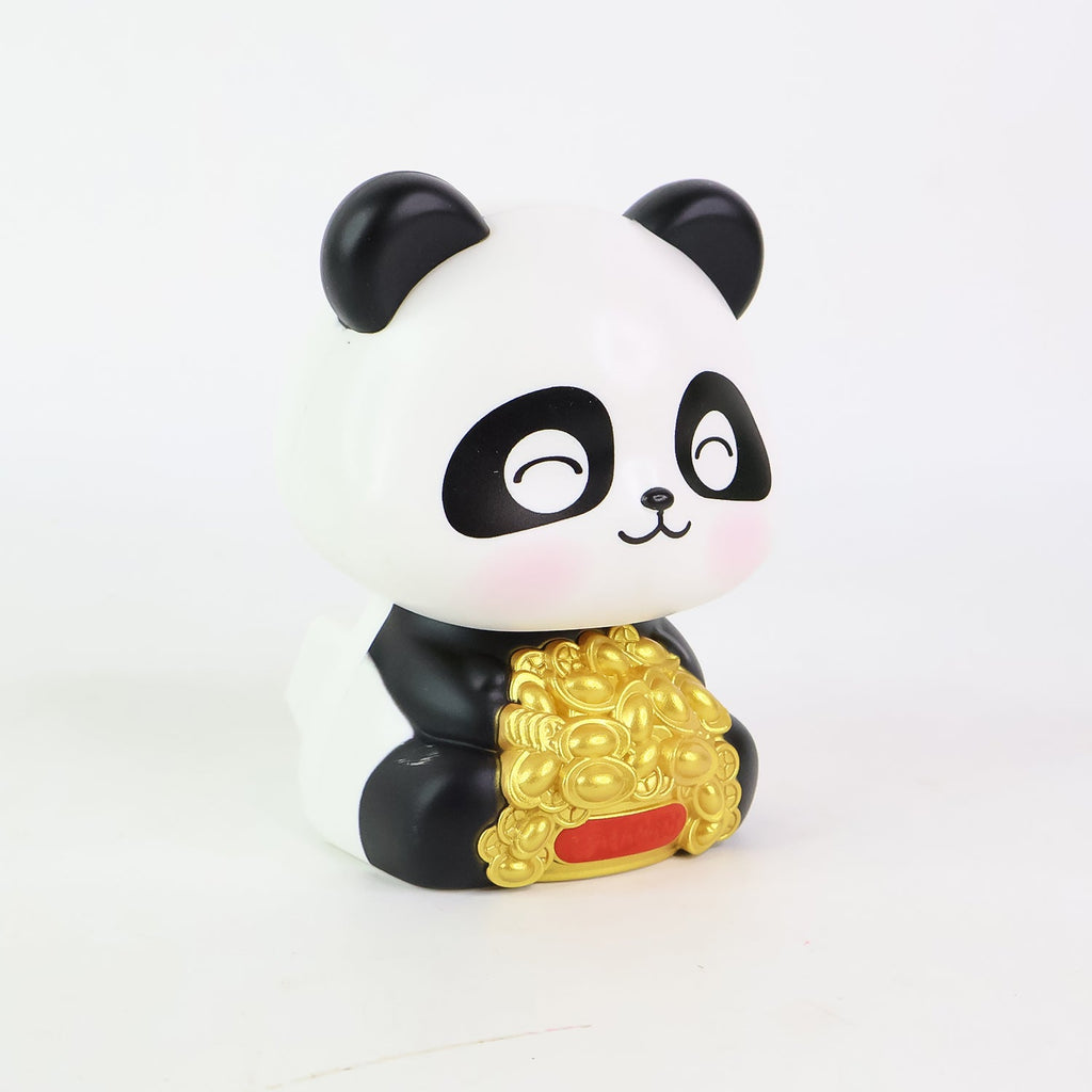 Solar panda figurine shown with its product packaging, highlighting its gift appeal.
