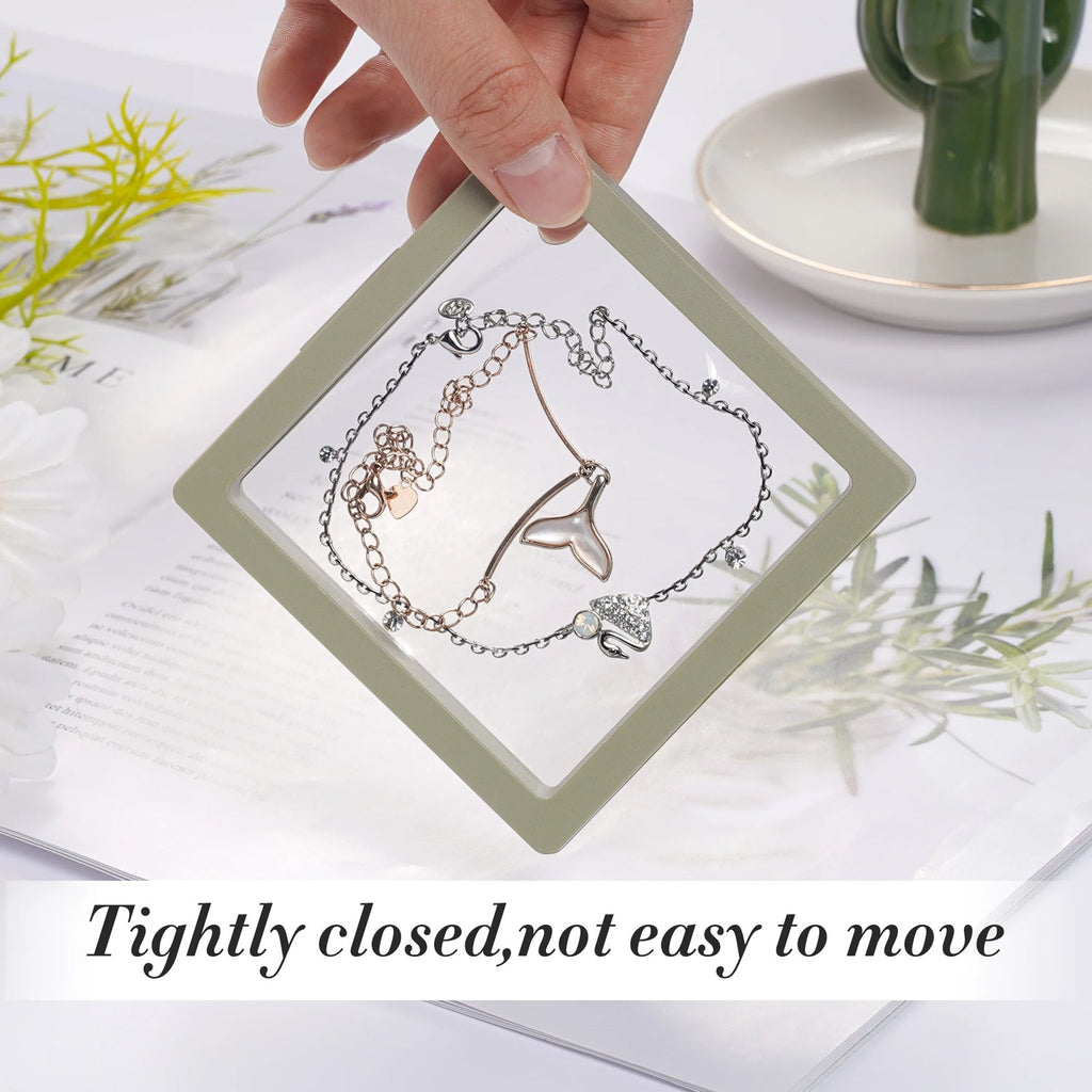 Transparent Floating Jewelry Display Box with a pearl necklace and stud earrings.