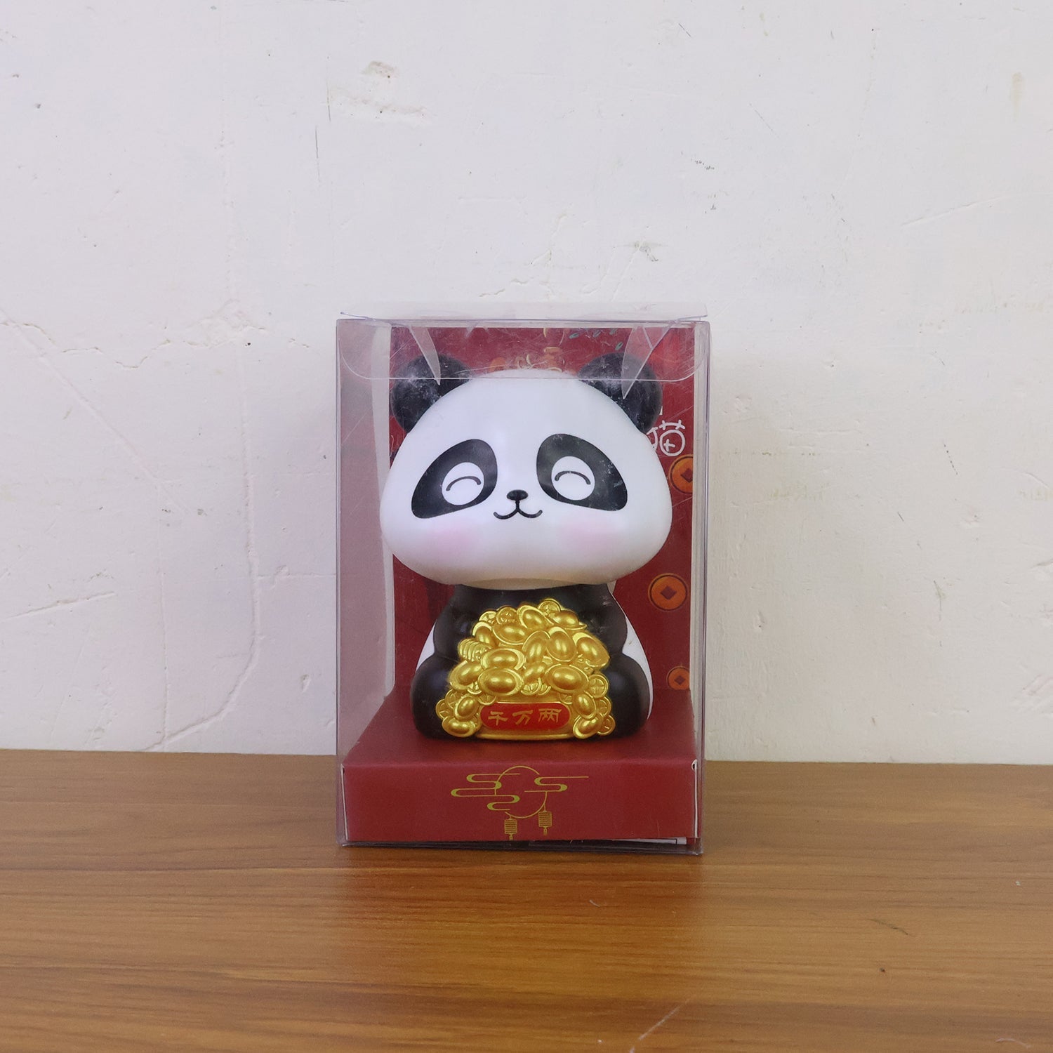Multiple solar panda figurines in various poses, emphasizing their charm as car interior accessories.