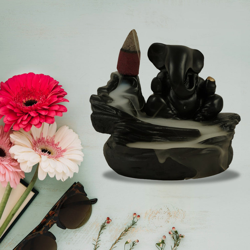Smoke Fountain Ganesha Idol with backflow incense effect, perfect for home decor.