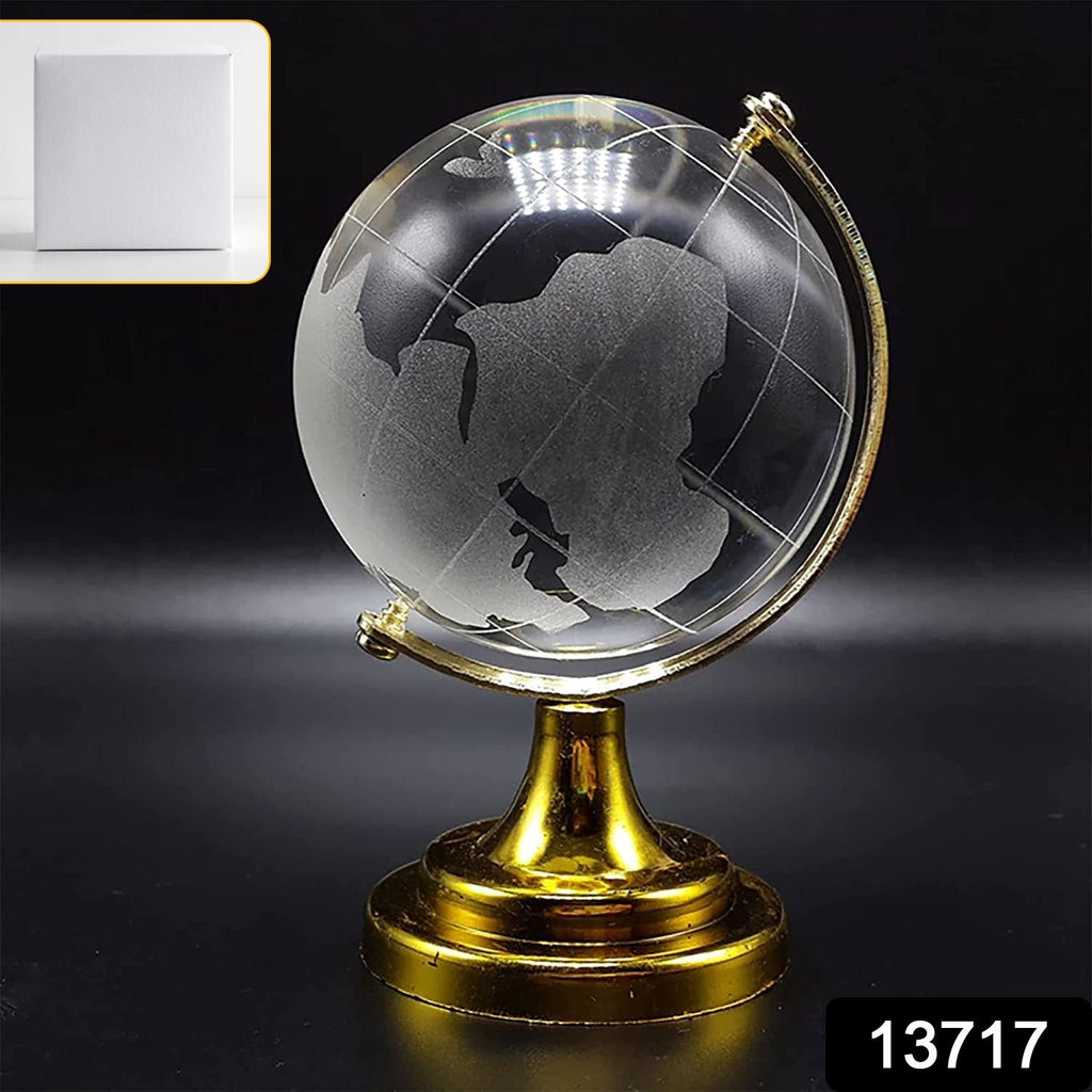 Close-up of a Crystal World Globe showing detailed world map etching on a golden stand.