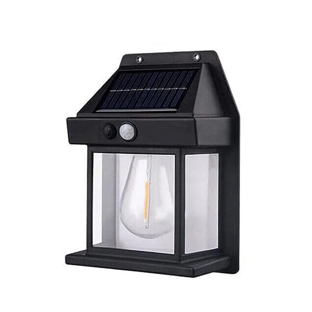Hand holding a Solar Wall Lamp to show its compact size and design.