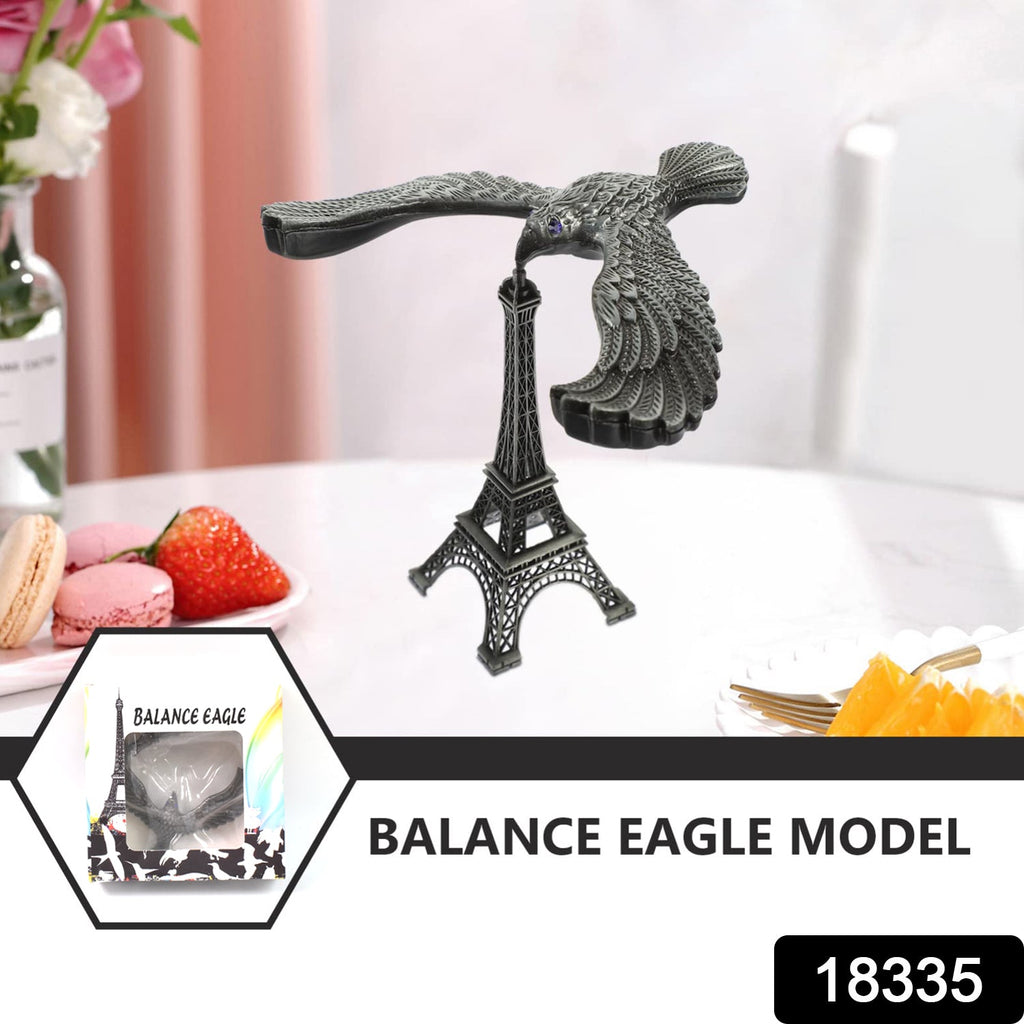 Close-up of the metal Balancing Eagle Toy, highlighting the intricate details of the bird's wings and beak.