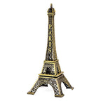 Side view of the metal Eiffel Tower statue, showcasing its 3D design.