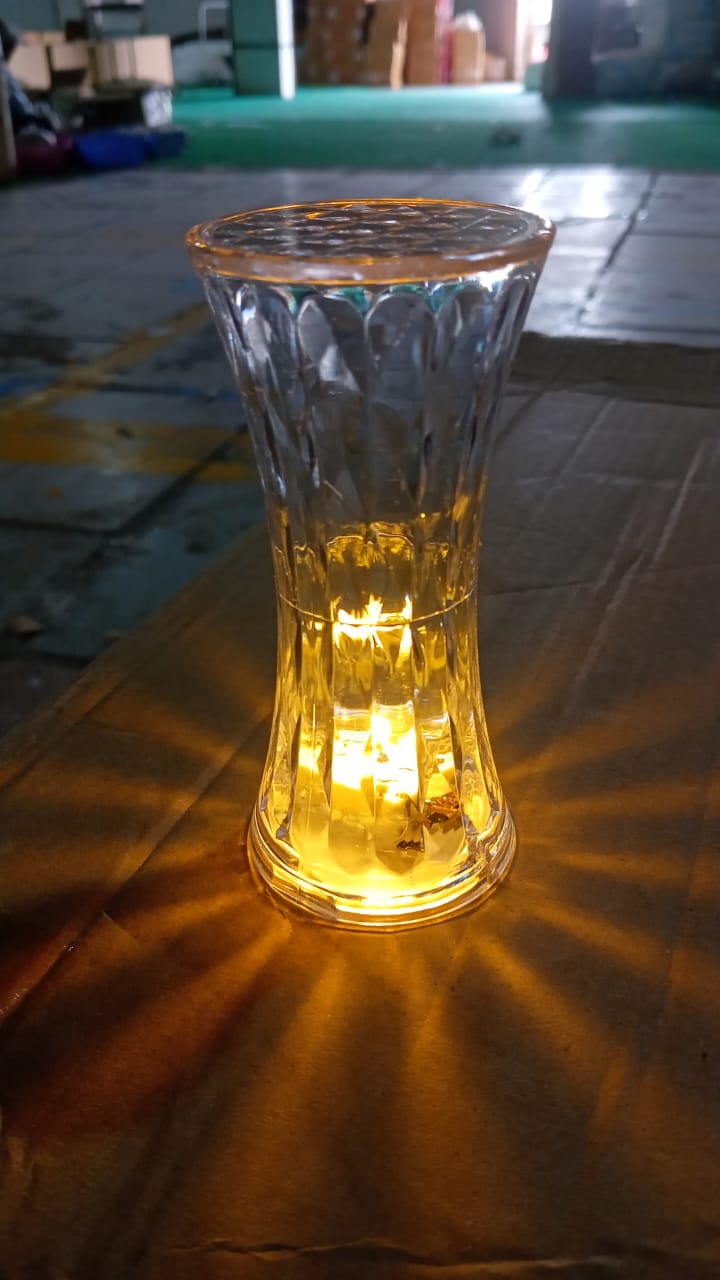 Hand holding the portable Crystal Night Light Lamp, highlighting its size.