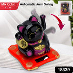Close-up of the smiling Waving Lucky Cat with its arm waving automatically.