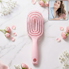 Pink curved vented detangling hair brush designed for effortless hairstyling