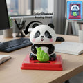 Solar powered moving head panda showpiece on red base