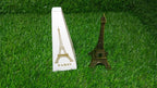 Antique finish Eiffel Tower metal statue from an elevated angle.