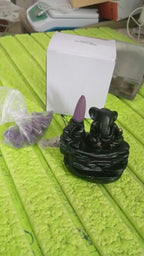 Ganesha Murti Smoke Fountain with included incense cones, ready for use.
