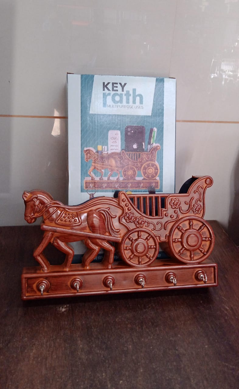 Product packaging for the Indo Glow Rath wall key holder, ensuring safe delivery.